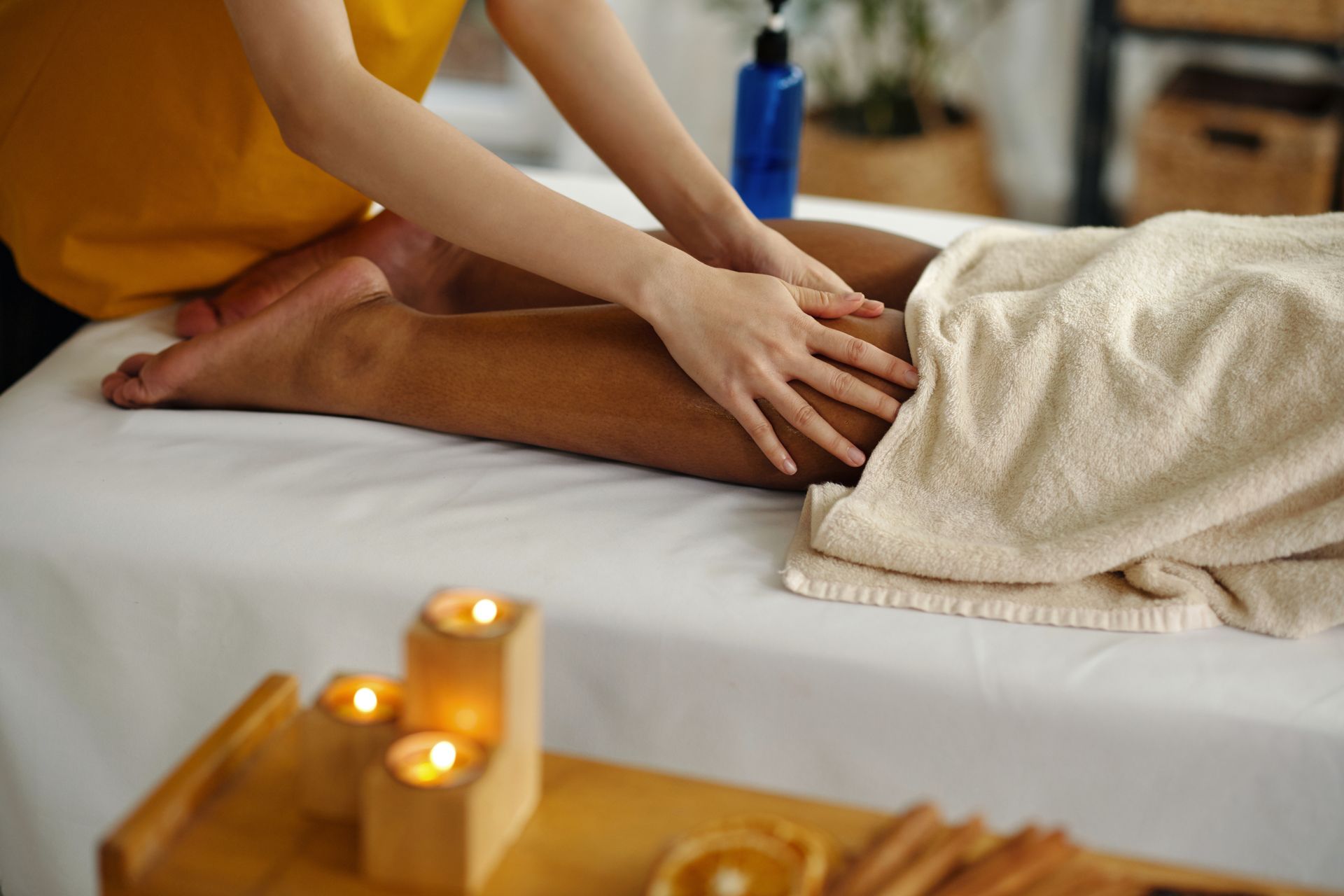 A woman is giving a man a massage in a spa.