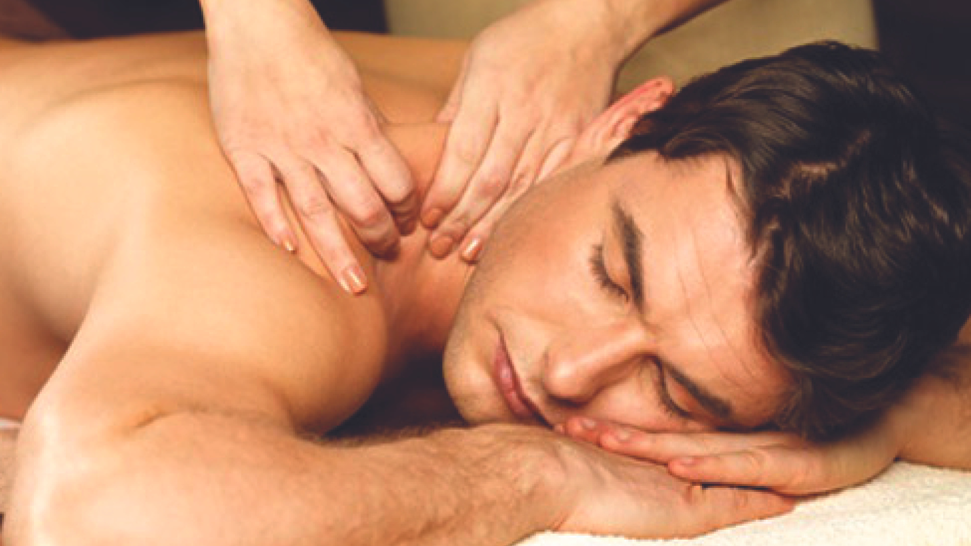 A man is getting a massage at a spa.