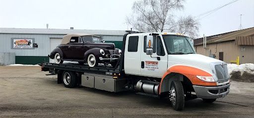 orange-and-white tow truck from Topel's Towing and Repair, Inc. in Lake Mills, WI