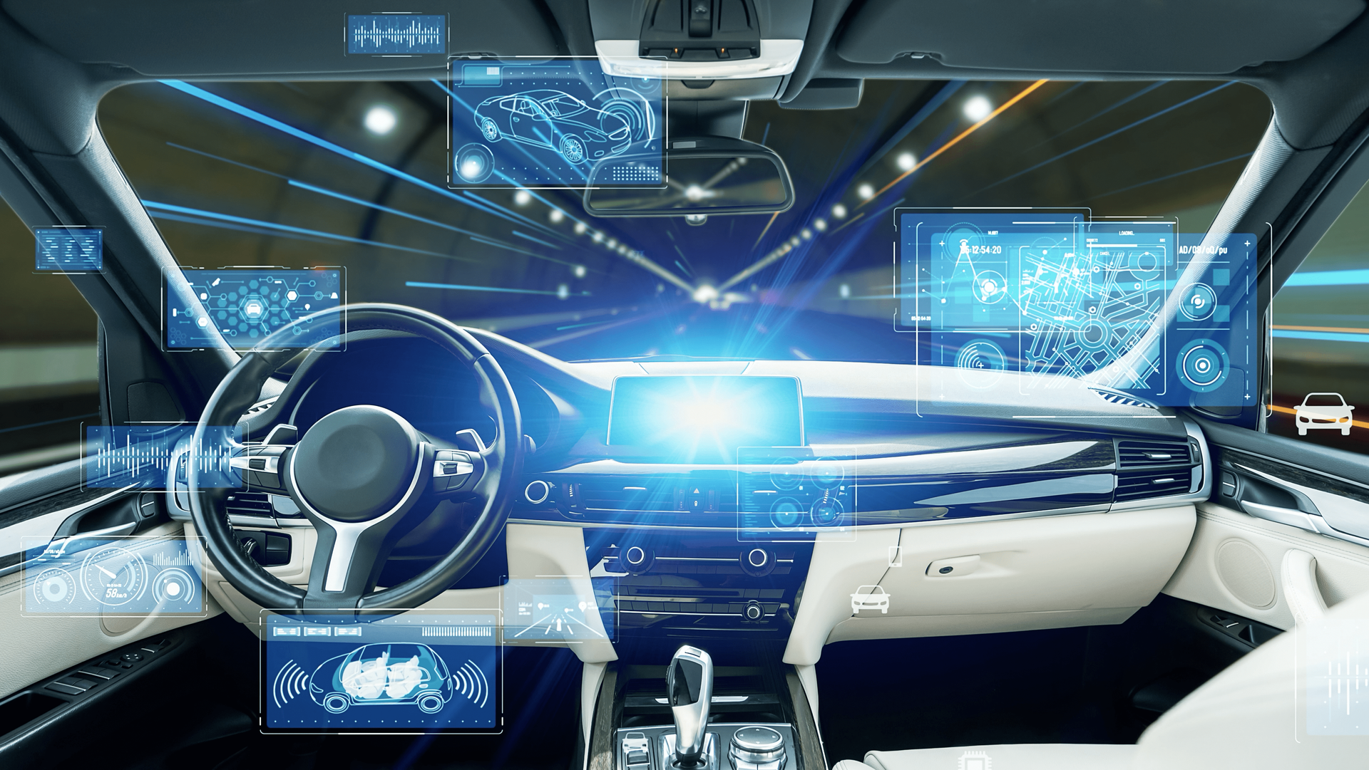 ADAS calibration services in Lake Mills, WI with Topel’s Towing & Repair INC. Image of inside of car driving in tunnel with all of the advanced driving system technologies showing as diagrams in the windshield.
