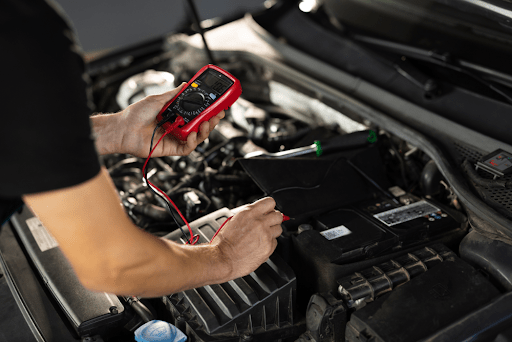 EV Battery Health Check in Fall: A technician performing an EV battery inspection, emphasizing the i