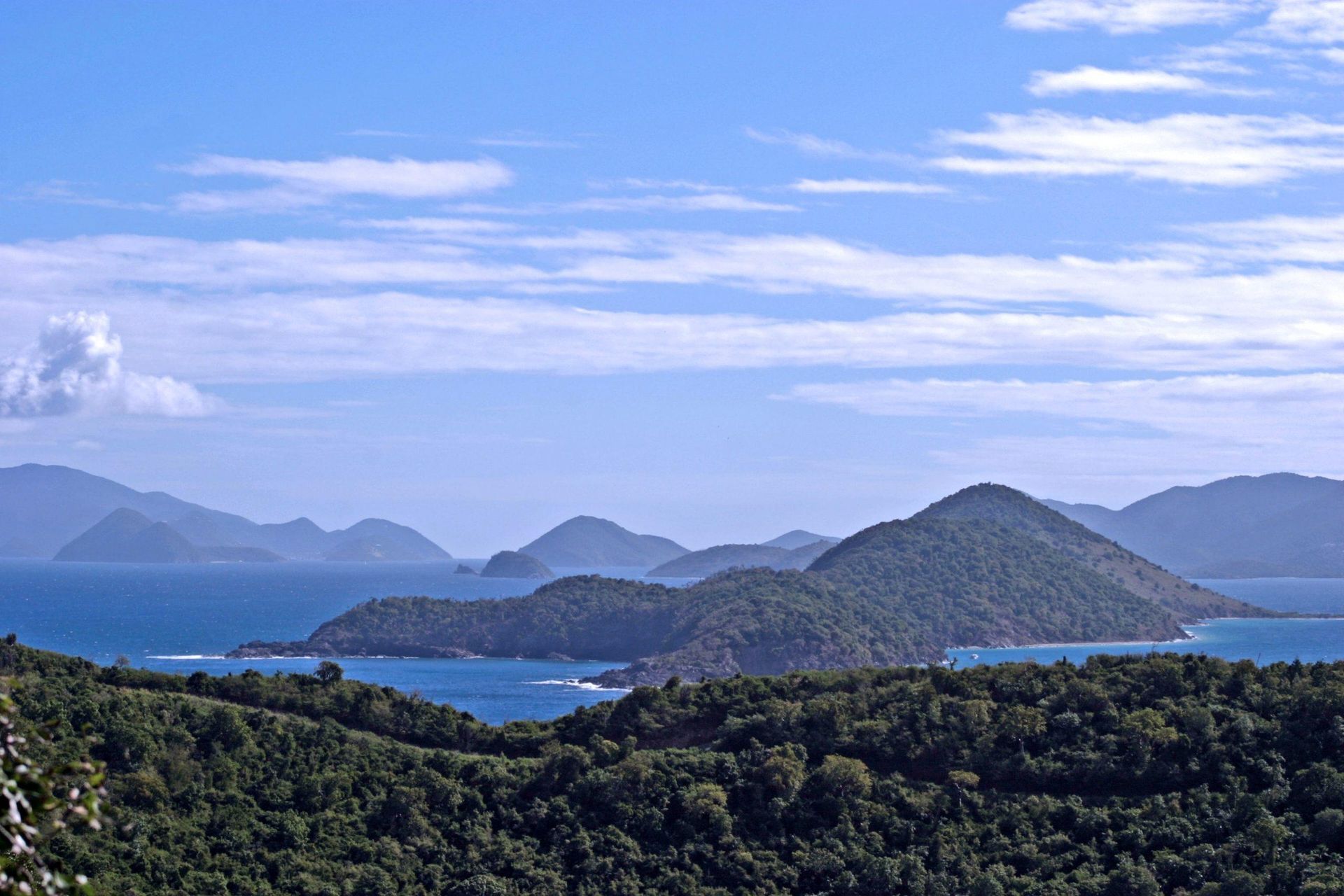 hiking peak image of several small, forested islands