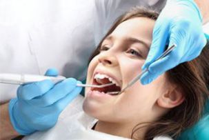 Dental Services for Kids — Little Girl Getting Her Teeth Checked in Rohnert Park, CA