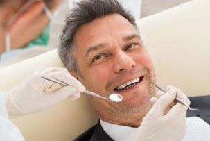 Teeth Whitening — Man Getting His Teeth Checked in Rohnert Park, CA