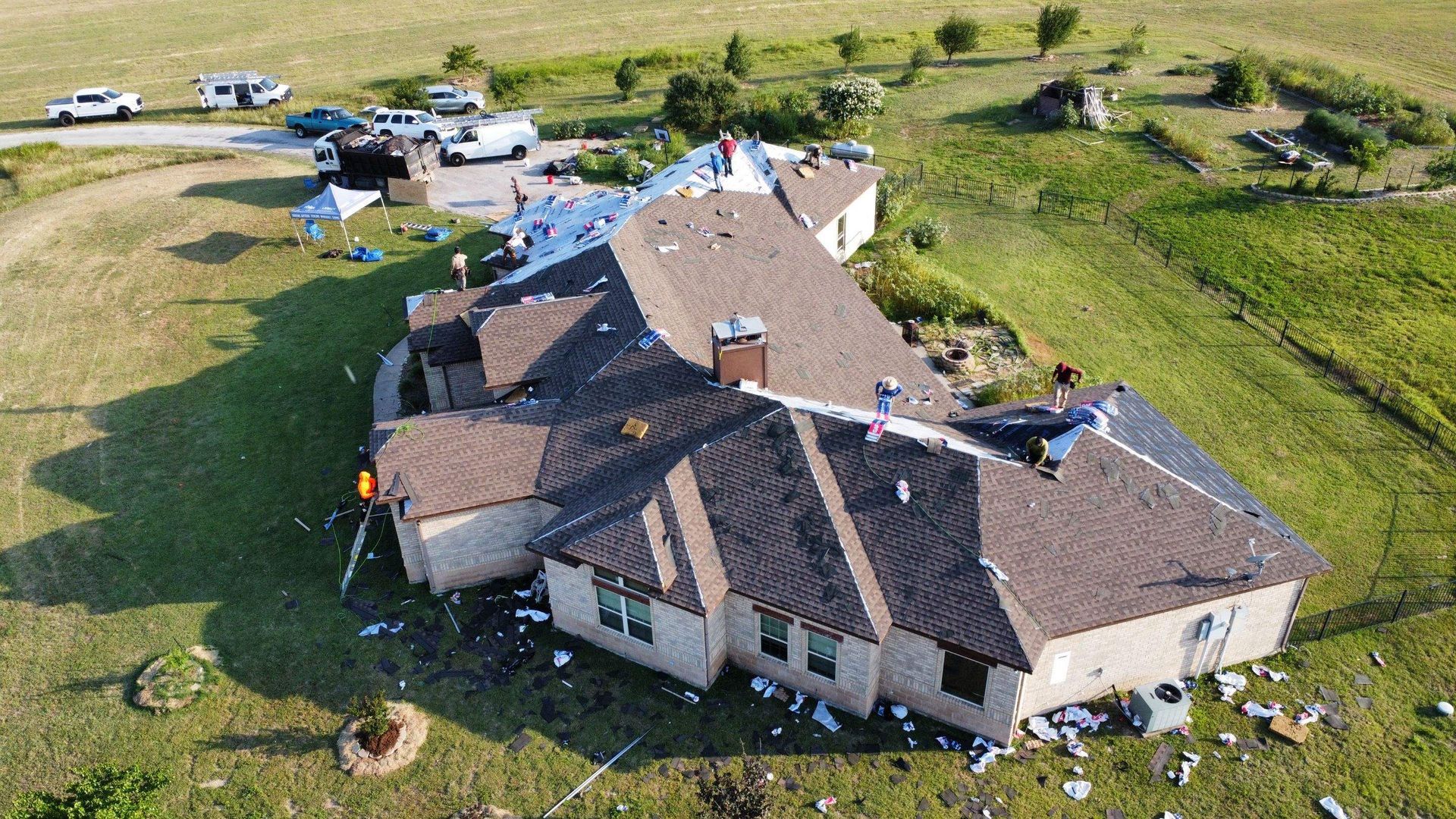 An aerial view of a house that has been damaged by a tornado.