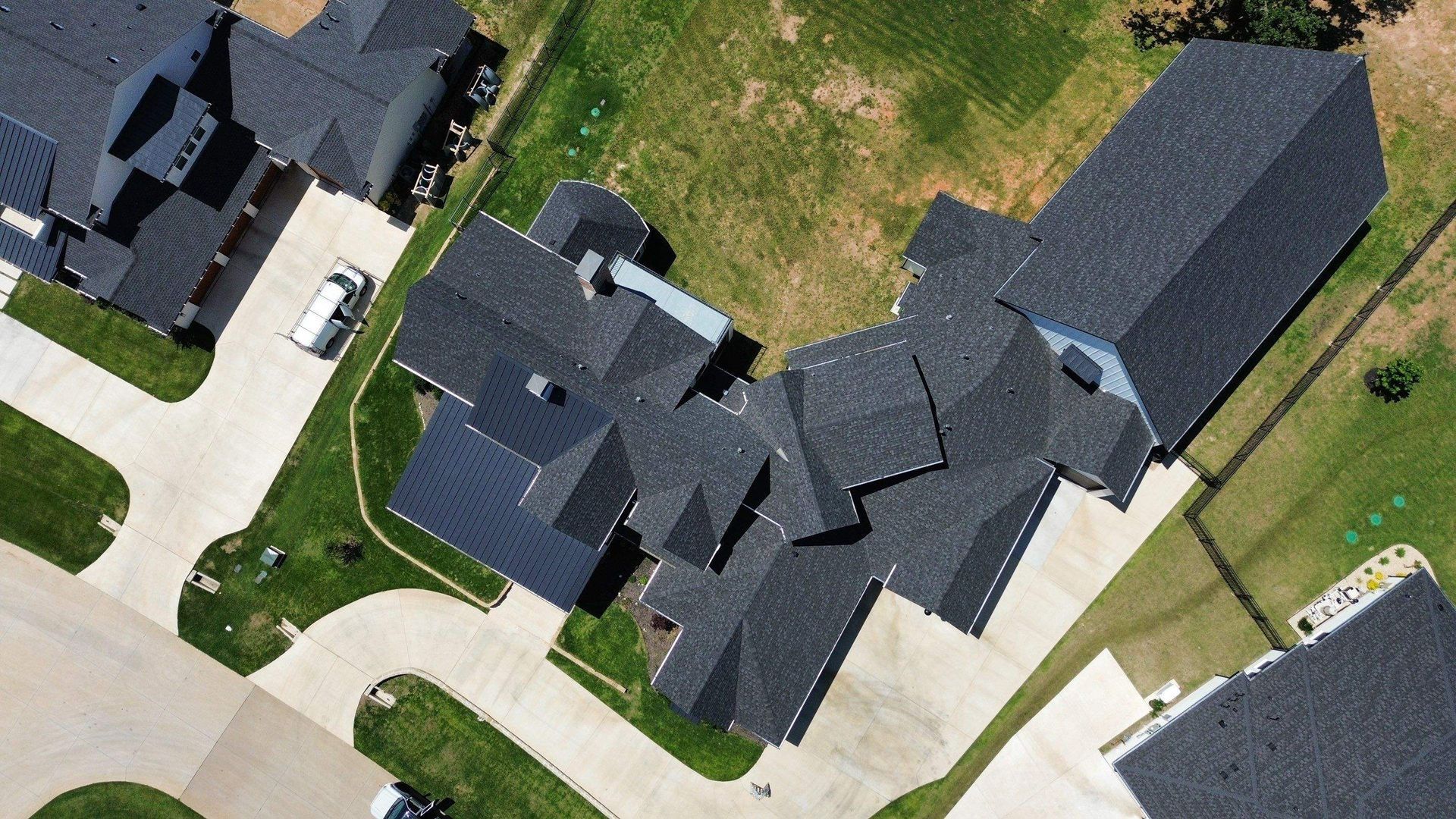 An aerial view of a residential area with a lot of houses