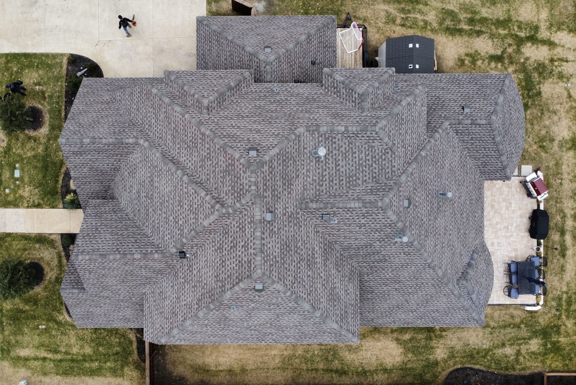 An aerial view of a house with a maze on the roof.