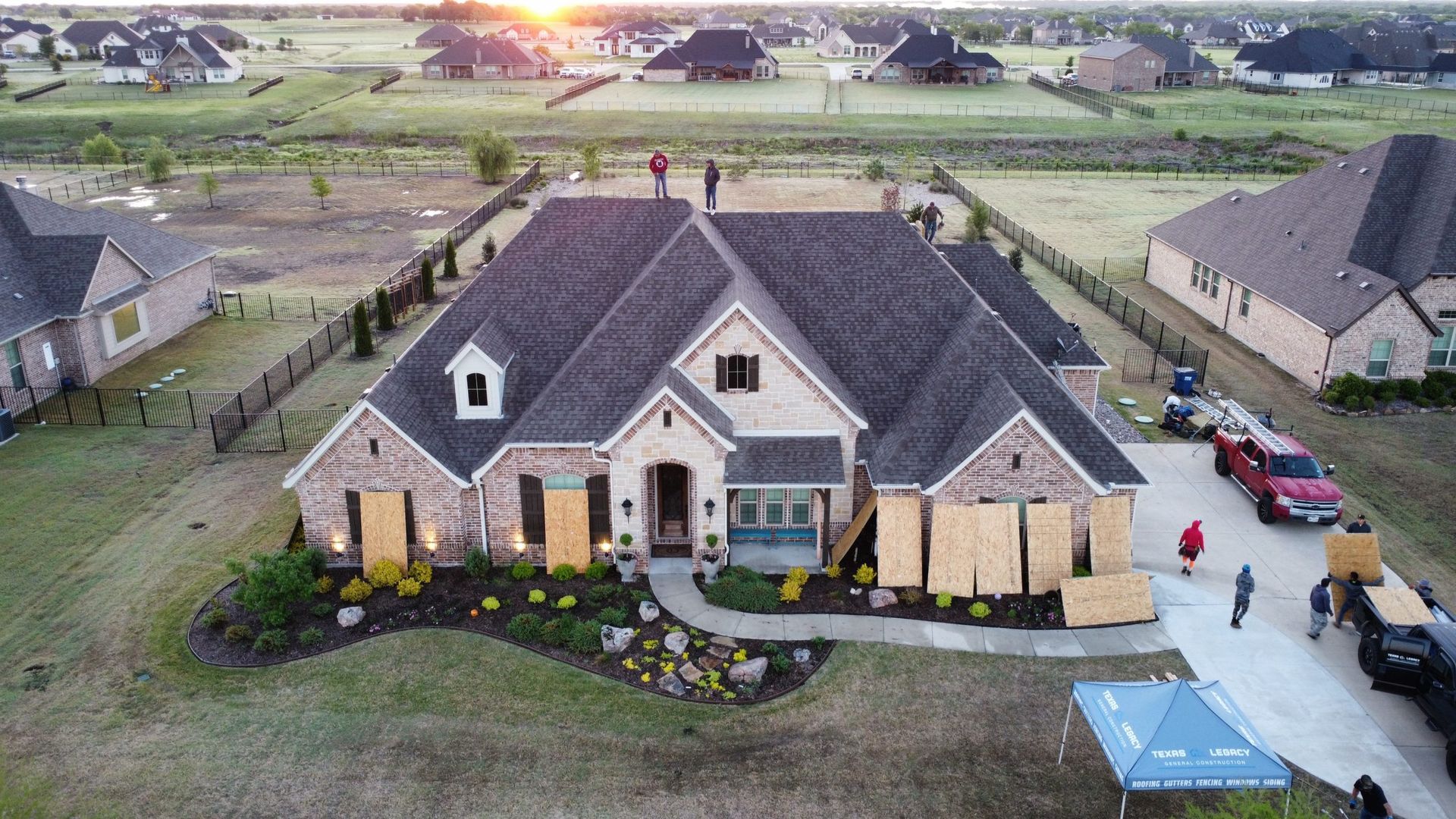 An aerial view of a house being built in a residential area.