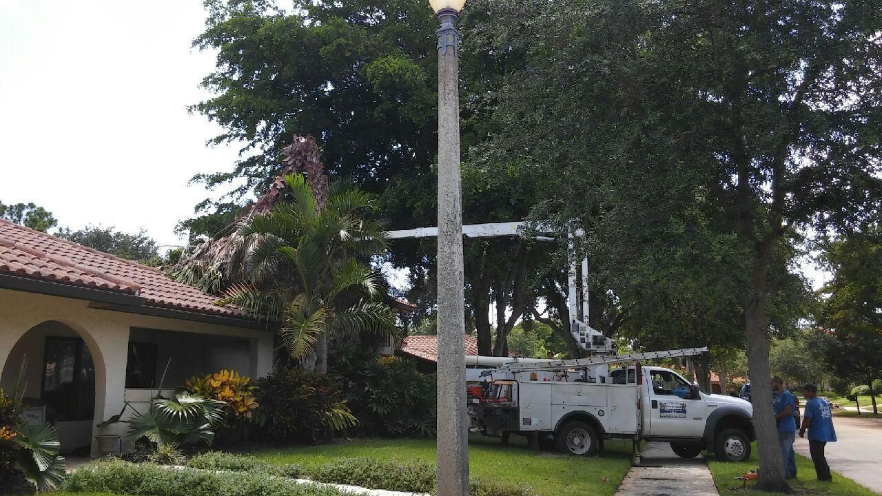 A white truck is parked in front of a house