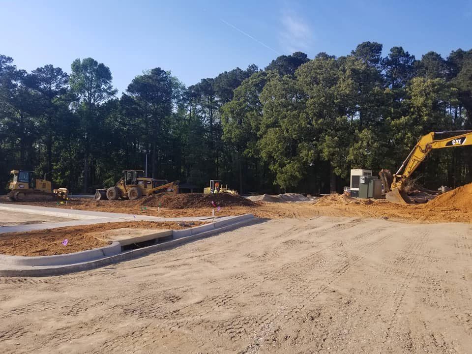 Large earth mover digger clearing land