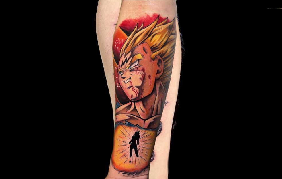 a tattoo of a dragon ball z character on a person 's leg .