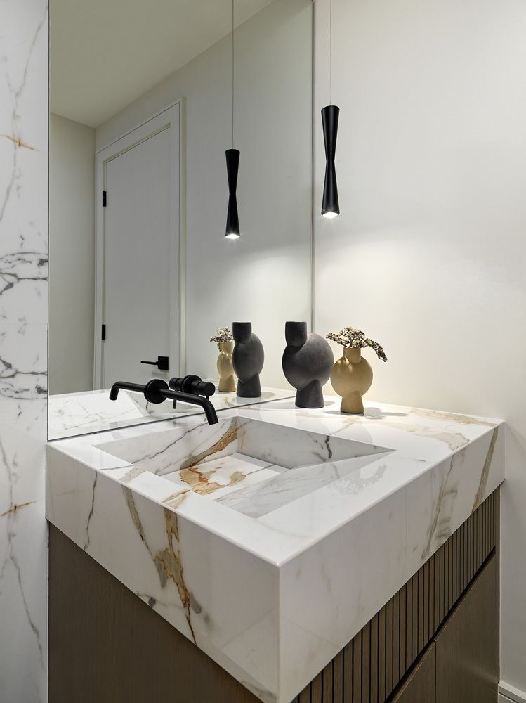 A bathroom with a sink and a mirror in Angelene St by Oakroots Construction