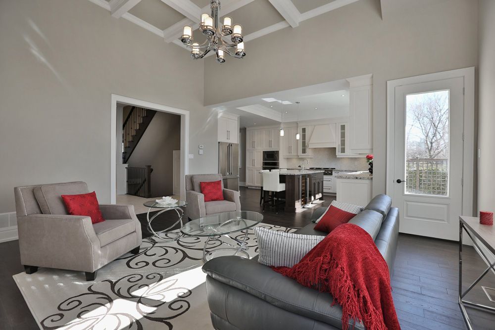 A living room filled with furniture and a chandelier.