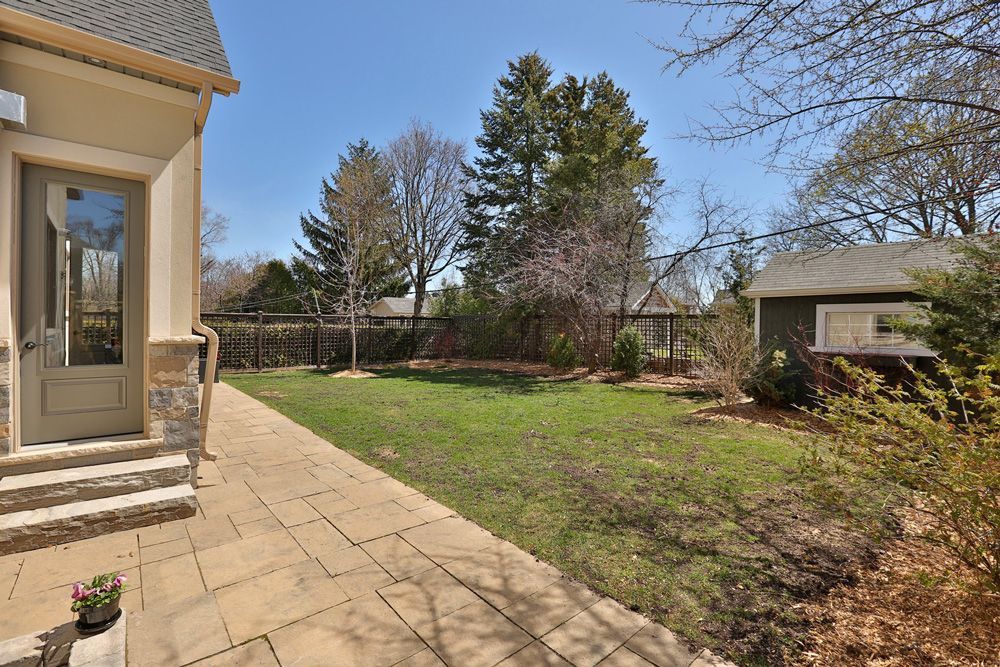 A house with a large lawn in front of it