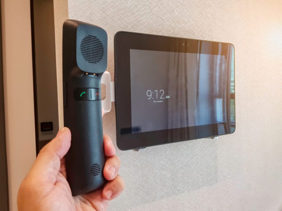 A Hand Holding a Black Telephone Receiver — Pacific Telephone & Data in Hunter Valley, NSW