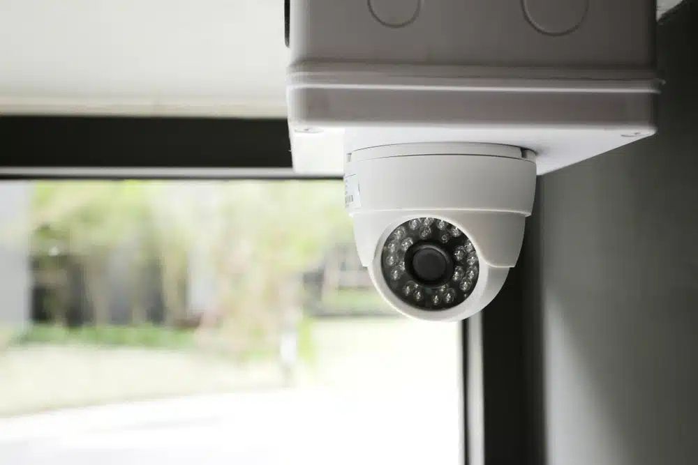 White Security Camera Mounted on A Ceiling — Pacific Telephone & Data In Cardiff, NSW
