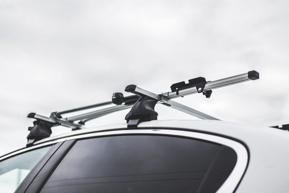 A White Car With A Roof Rack Attached To It — Superior Machinery Maintenance In Ryan, QLD