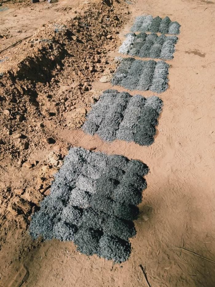 Five Piles of Gray Material Arranged on Brown Ground — Local Drilling Services In Kingaroy, QLD
