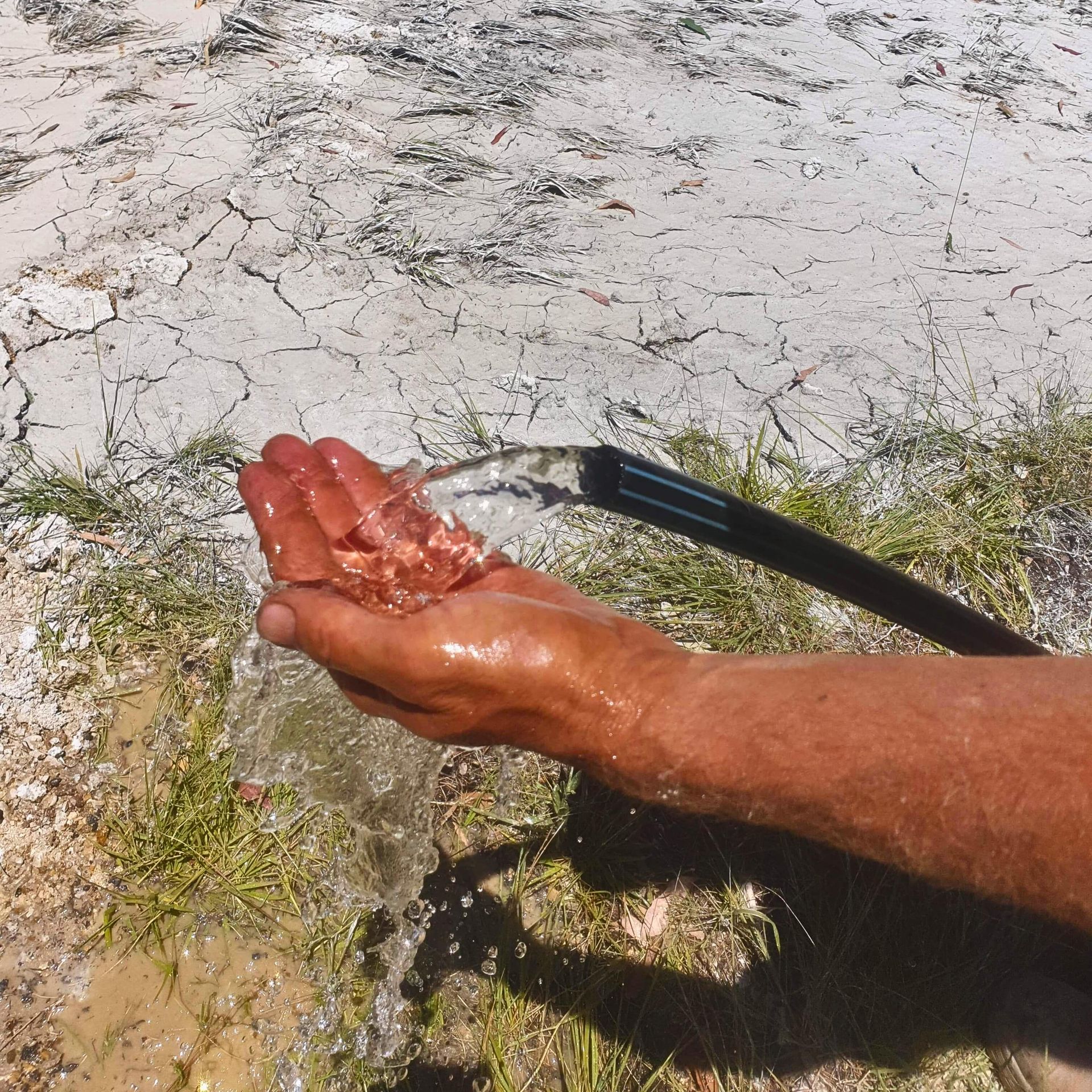 Clear water coming from a black hose — Local Drilling Services In South Burnett, QLD