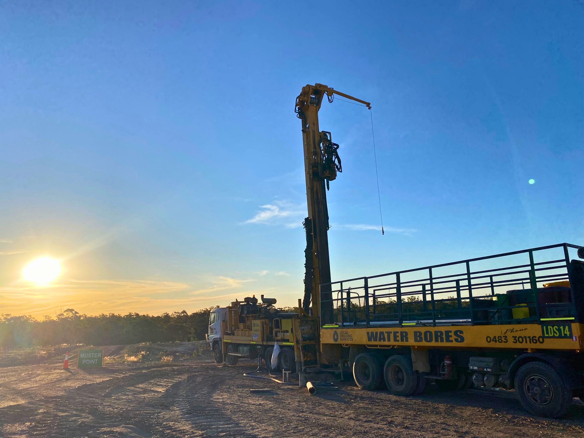Drilling Rig on a Truck at Sunset, Working on a Water Bore — Local Drilling Services In Esk, QLD