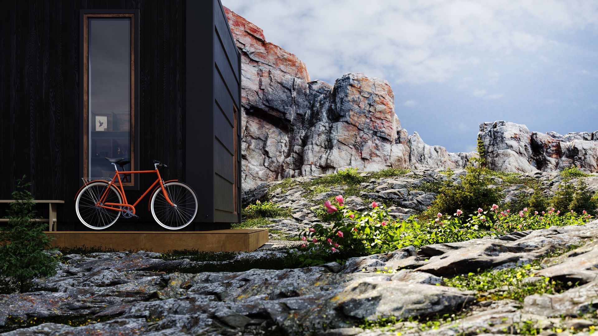 A bicycle is parked in front of a small house in the mountains.