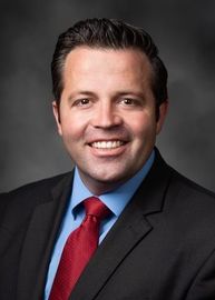 A house icon in a circle on a white background.