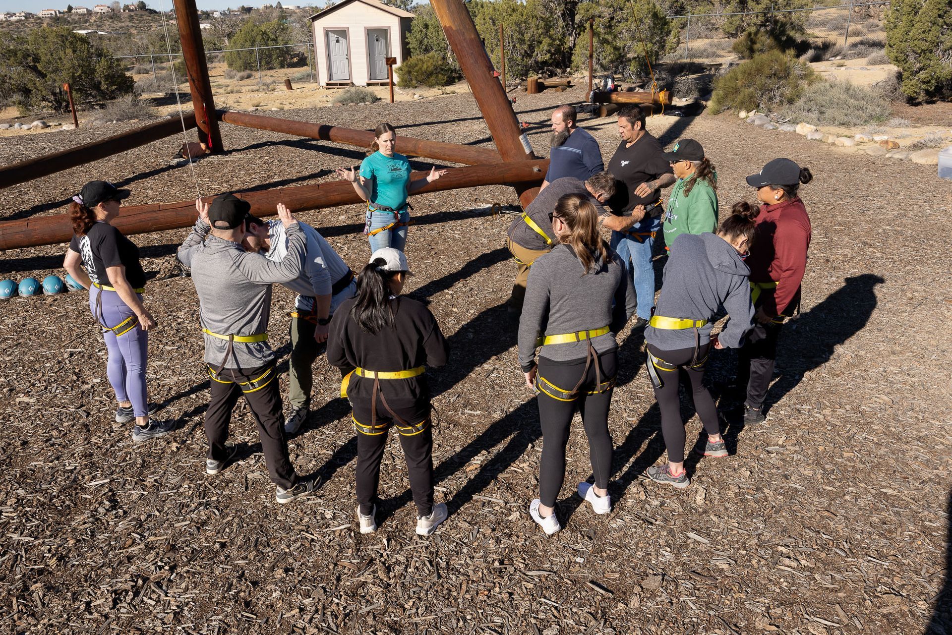 Man and woman in conversation on a couch; indoor setting.