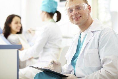 Dentist Holding a Note - Cosmetic and General Dentistry in Newton, NJ