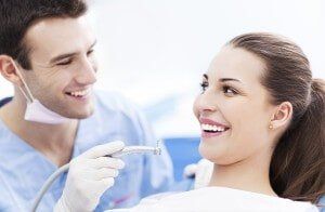 Dentist and a woman patient - Dental Care in Newton, NJ
