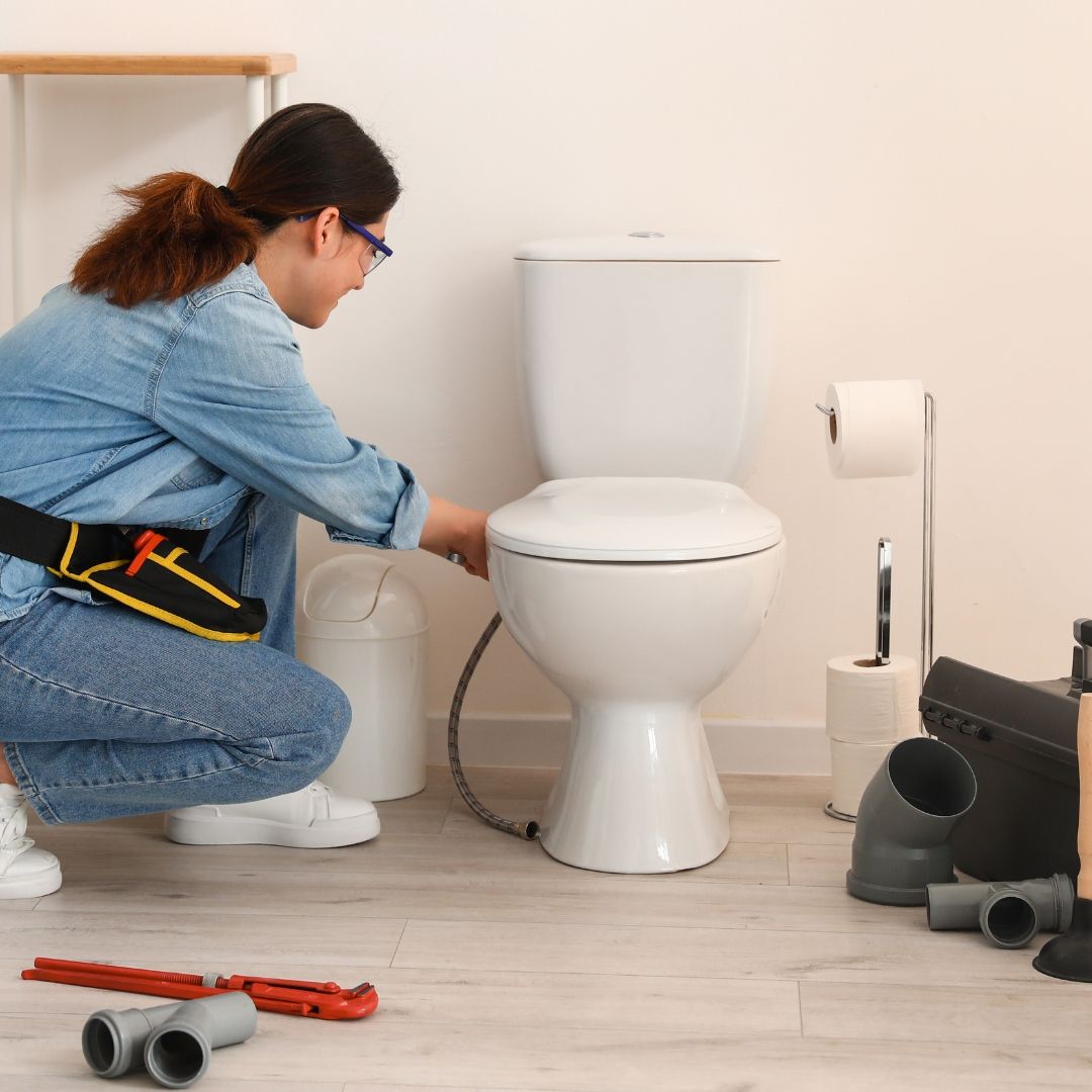 Picture of a toilet being serviced by a skilled technician, demonstrating effective repair solutions