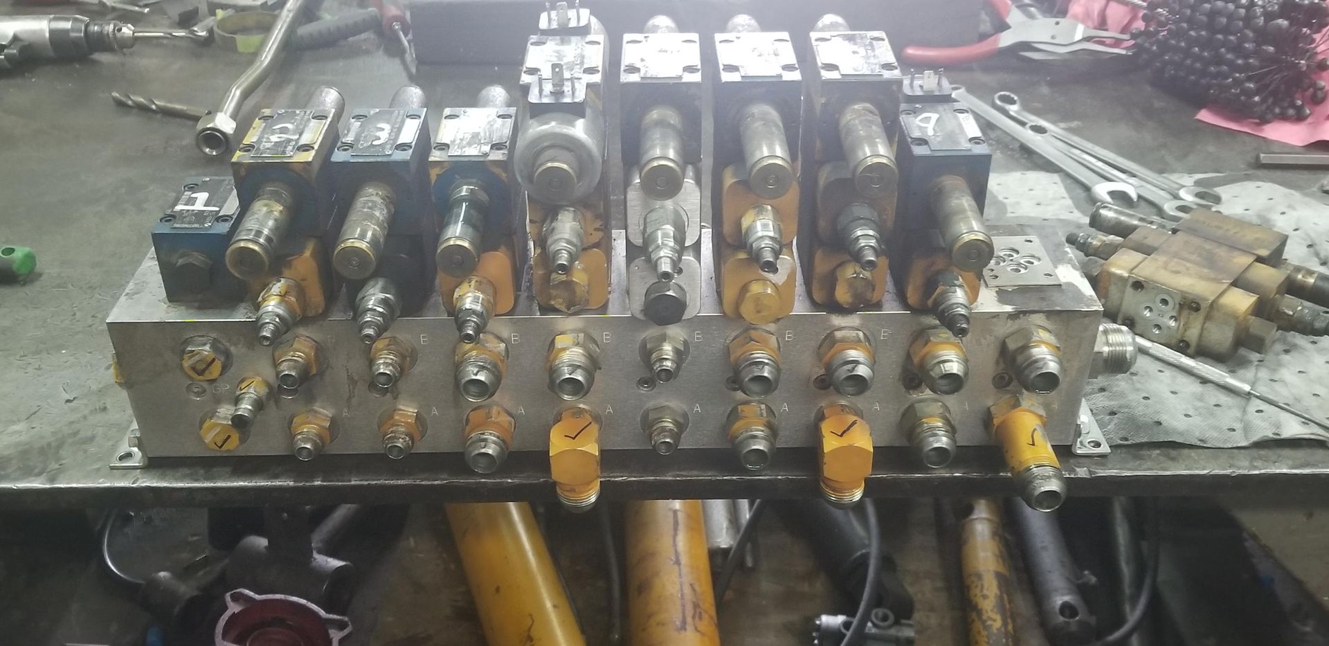 A Bunch Of Valves Are Sitting On Top Of A Table — Lake City, GA — A-1 Hydraulics