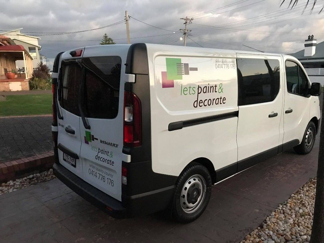 A White Van is Parked on the Side of the Road — Let's Paint & Decorate Pty Ltd in Oak Flats, NSW
