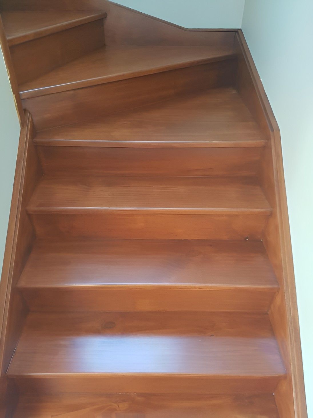 A Close Up of a Wooden Staircase in a House — Let's Paint & Decorate Pty Ltd in Bowral, NSW