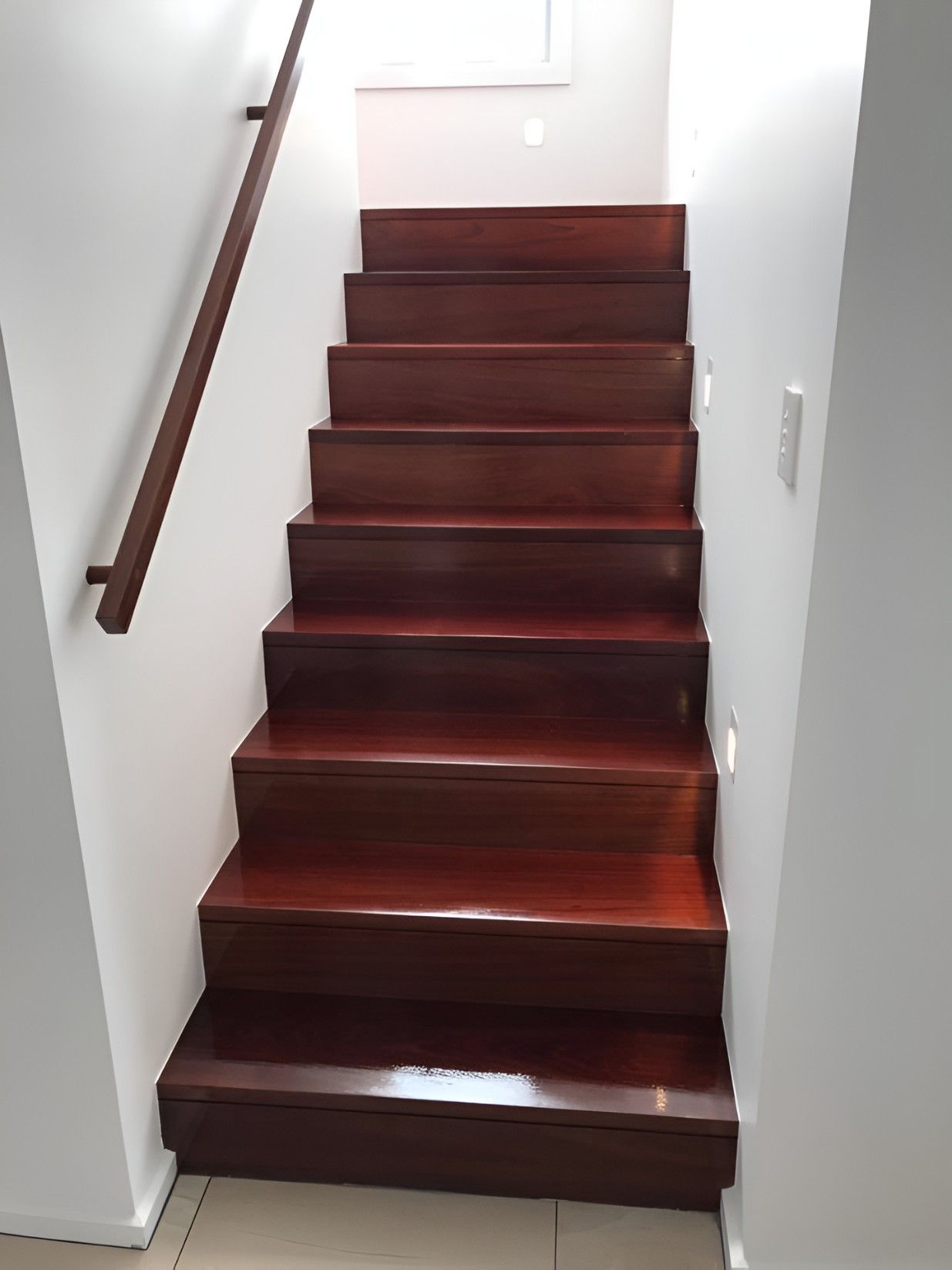 A Wooden Staircase With a White Wall — Let's Paint & Decorate Pty Ltd in Bowral, NSW