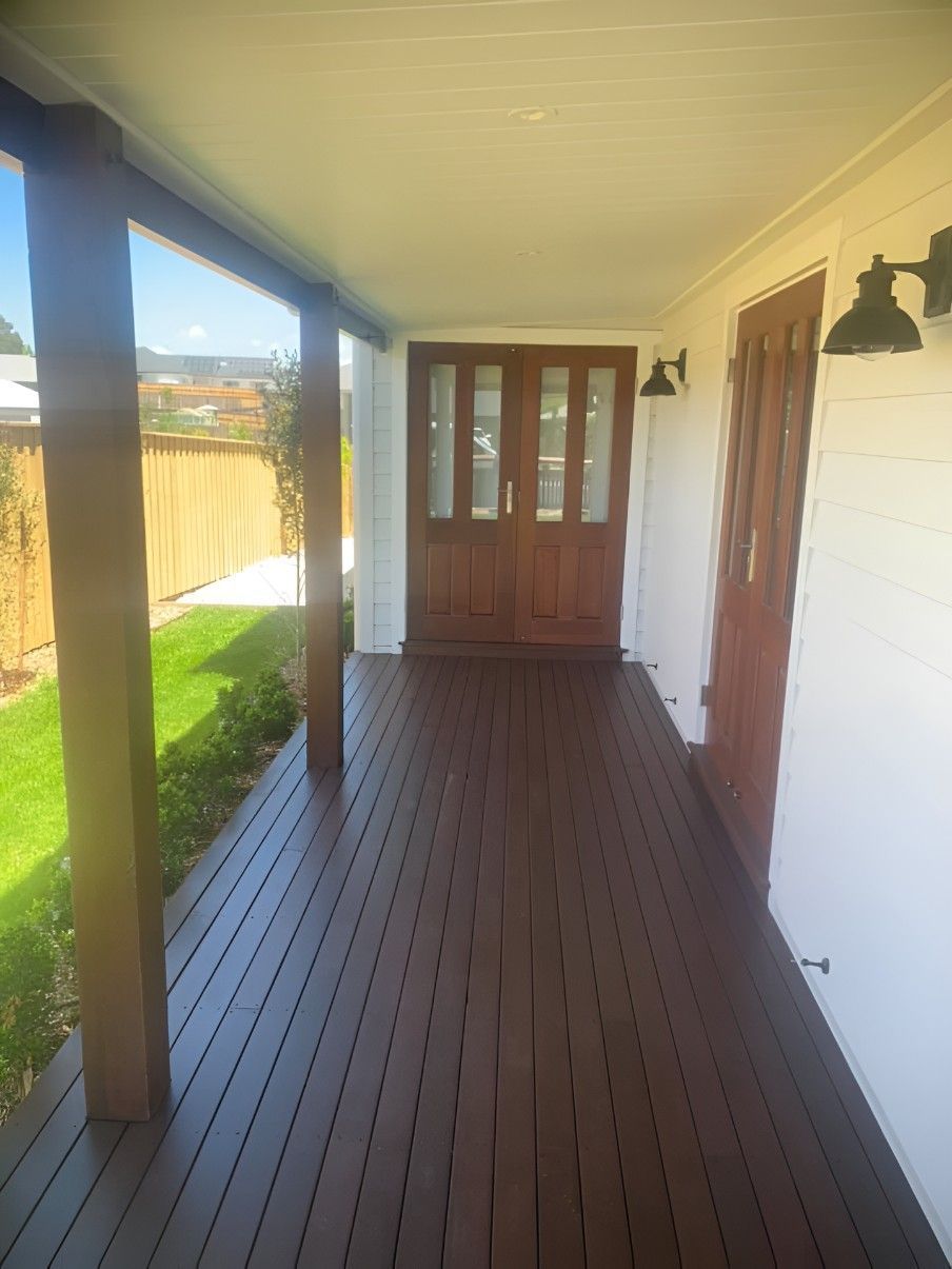 A Porch With a Wooden Floor and a Door — Let's Paint & Decorate Pty Ltd in Kiama, NSW