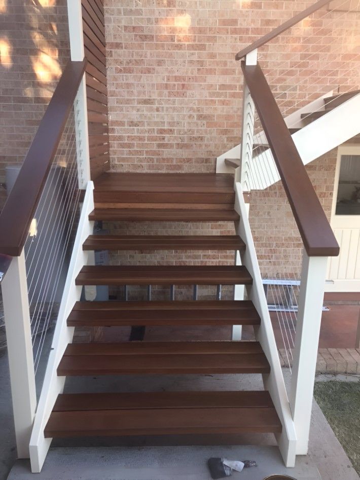 A Wooden Staircase With a White Railing — Let's Paint & Decorate Pty Ltd in Austinmer, NSW