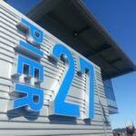 A sign with large, bright blue 