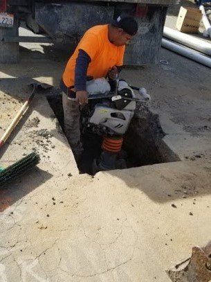 Water Heater Repair — Worker Digging for Sewer Replacement in Richmond, CA