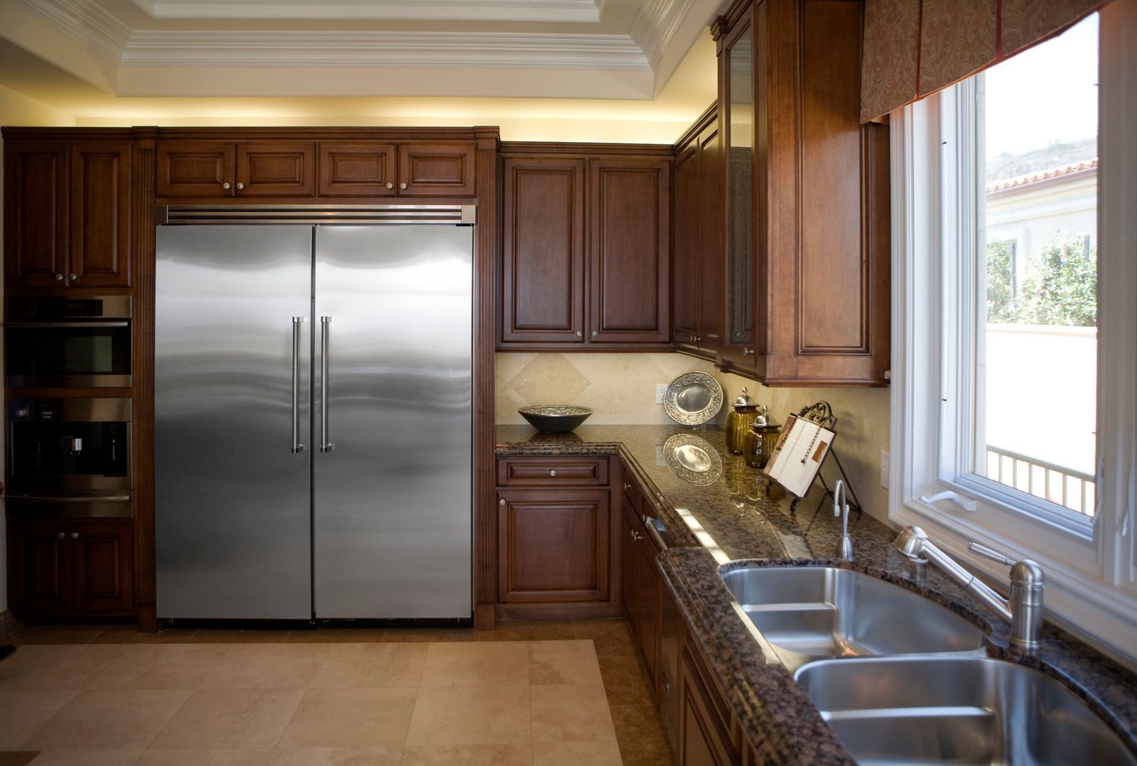 A kitchen with stainless steel appliances and granite counter tops