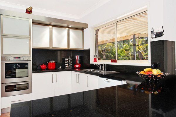 modern kitchen with black and red accents