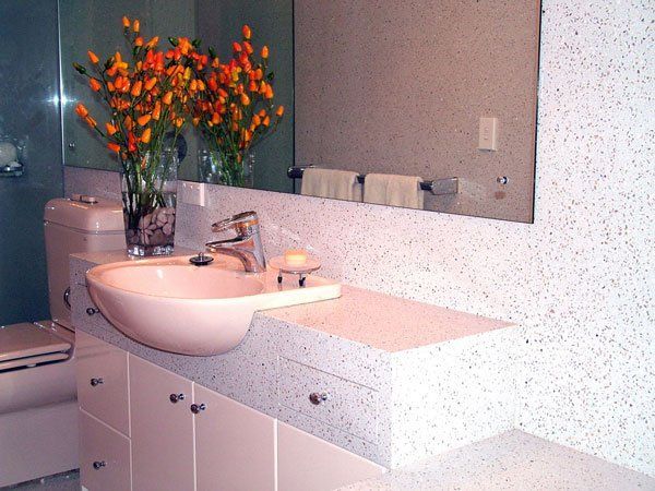 modern bathroom with flowers on counter