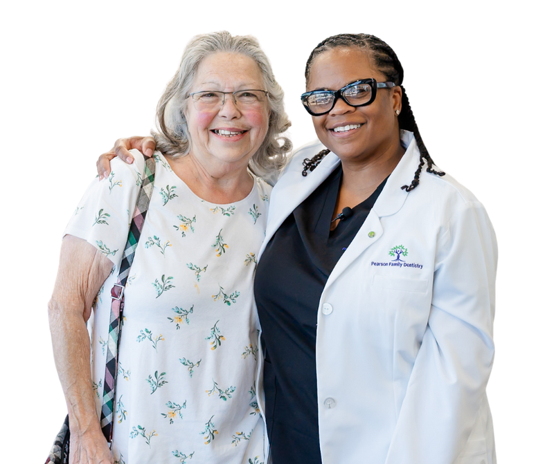 A man with a beard is smiling and giving a thumbs up