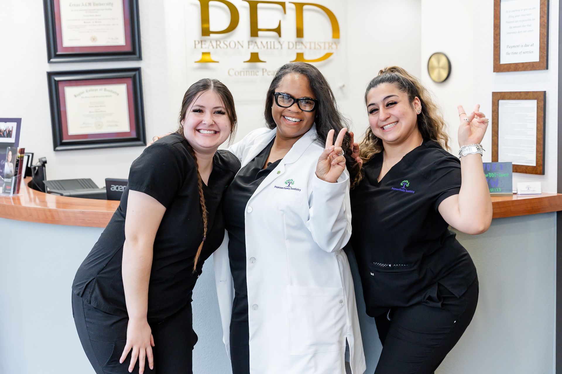 A woman is examining a man 's teeth in a dental office.