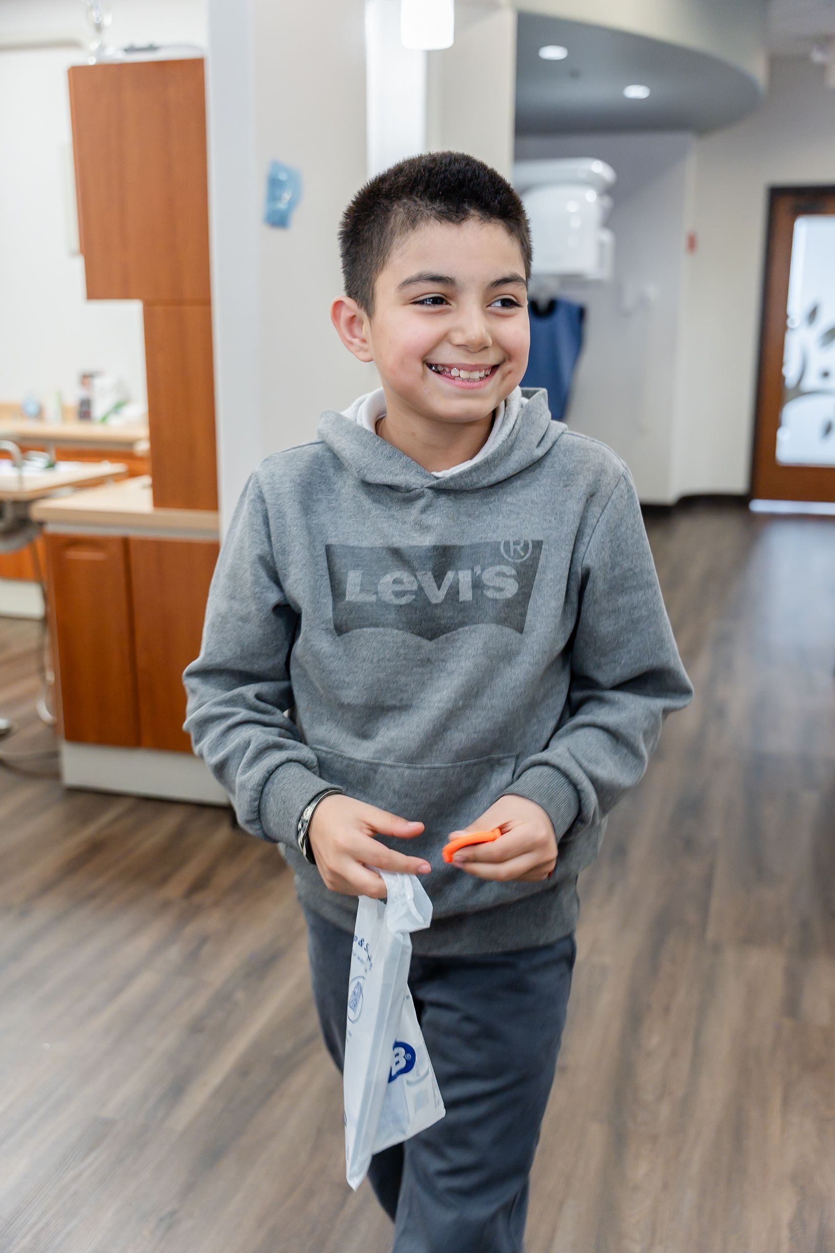 A person is pointing at an x-ray of a person 's teeth