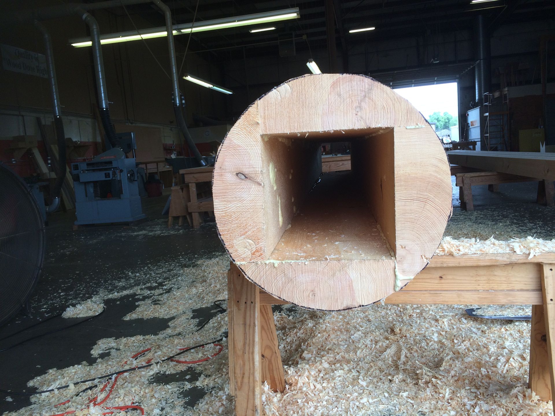 a false log carved to enclose a steel beam