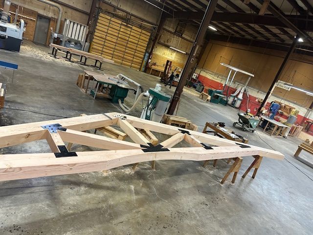 a timber truss under construction