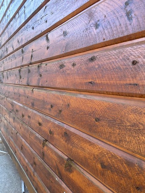 a wall covered in tongue and groove wood paneling