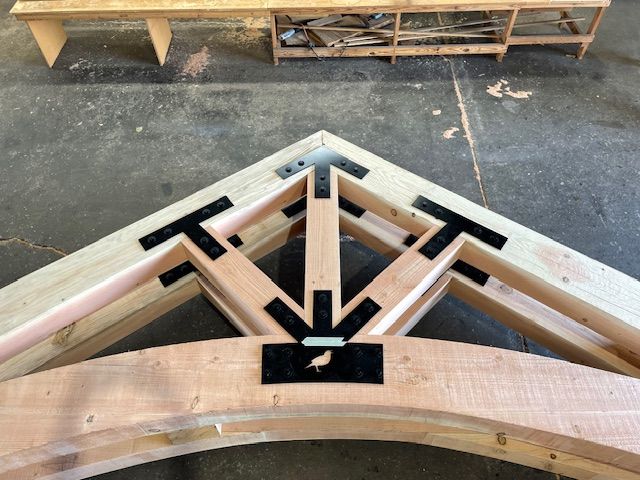 a timber truss under construction
