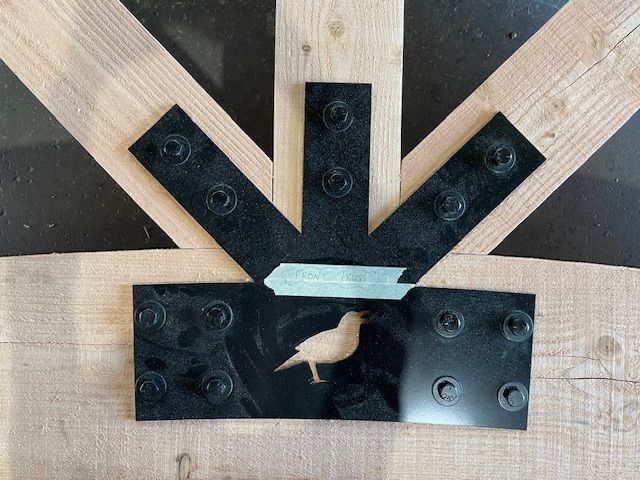 a timber truss under construction