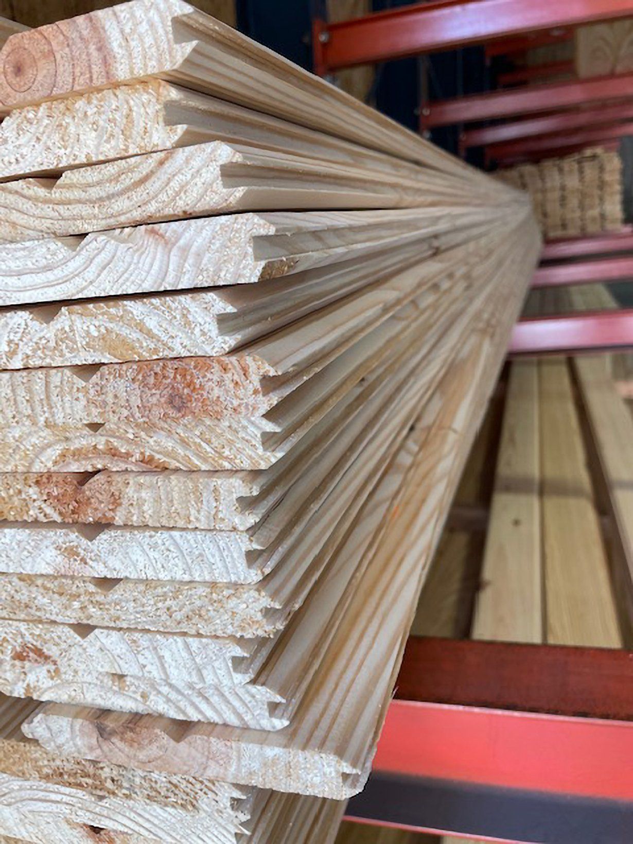 a stack of shiplap siding boards